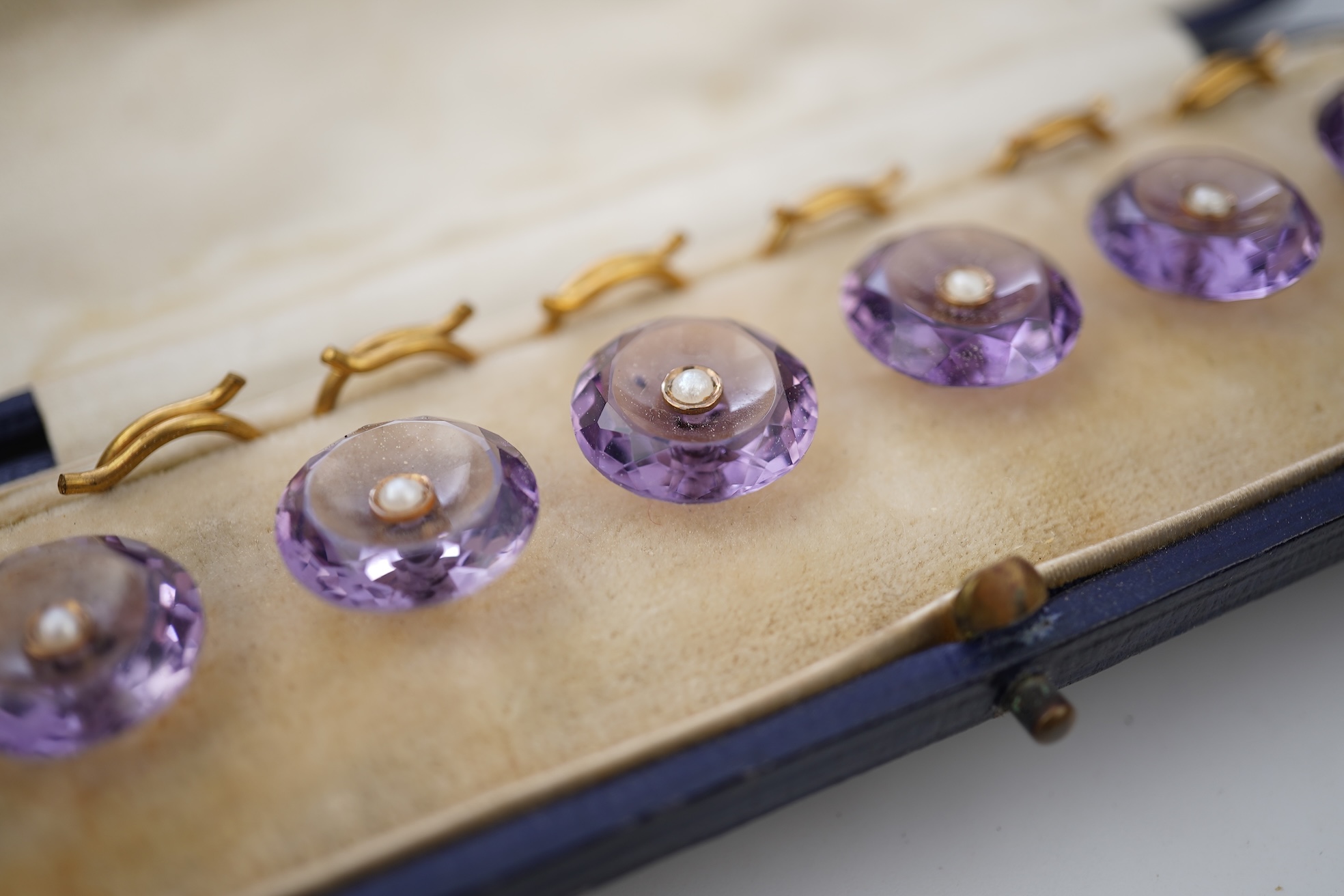 A rare set of amethyst and seed pearl buttons, circa 1900